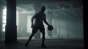 African american man basketball training in dark building. Professional player bounce basketball ball. Strong sportsman playing basket ball game. Strong athlete silhouette dribble ball in sport club - Powered by Shutterstock - Get 15% off with code: PIKWIZARD15
