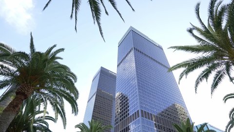 Los Angeles, CA, USA - Nov 5, 2021: Low angle shot downtown Los Angeles. LA offices, hotels, apartments. 4k slow motion. Concept of American modern urban lifestyle, city life work in LA.