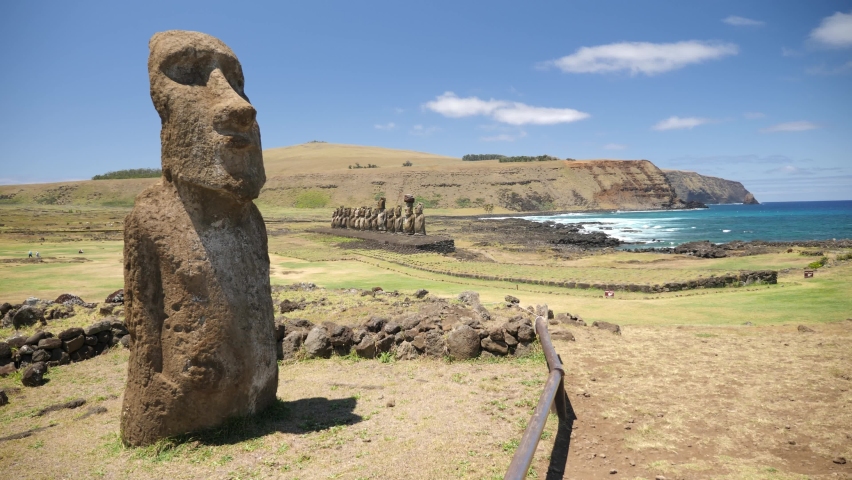 Moai statues Ahu Tongariki side on Easter Island, Chile. Statues of Easter Island in Chile. Mysterious Giant megalith Moai statues. Stunning shot of mysterious monoliths on a perfect sunny day. Royalty-Free Stock Footage #1082222882