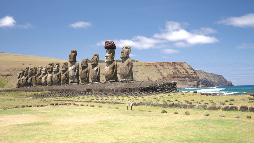 Moai statues Ahu Tongariki side on Easter Island, Chile. Statues of Easter Island in Chile. Mysterious Giant megalith Moai statues. Stunning shot of mysterious monoliths on a perfect sunny day. Royalty-Free Stock Footage #1082222885