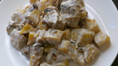 Vegetarian stew with mushrooms, turnip and potatoes with cheese sauce