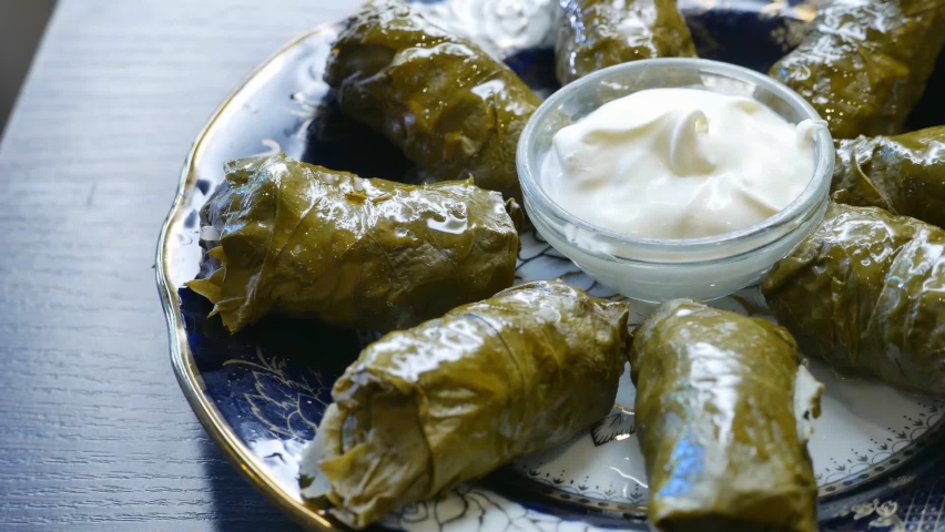 Delicious dolma with the cream sauce on a asian plate | Shutterstock HD Video #1082223023