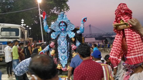 Video taken on 7th.  November 2021 at 17:13 pm on the bank of river Hooghly Kolkata India.  Video shows the goddess kali idol is being taken to river for impression.