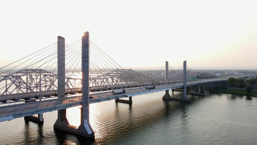 Aerial drone view of cars and trucks on bridges in Louisville, sunny evening in Kentucky, United states