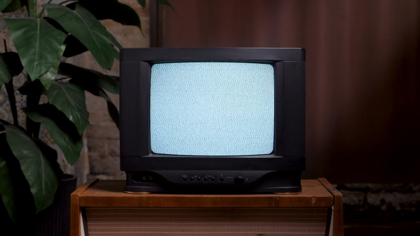 Man hitting old TV screen close up. 80s home interior old television set. Bad television signal noise. No signal tv turning on screen hand knocking retro static noise. Analog static effect retro tv Royalty-Free Stock Footage #1082236802