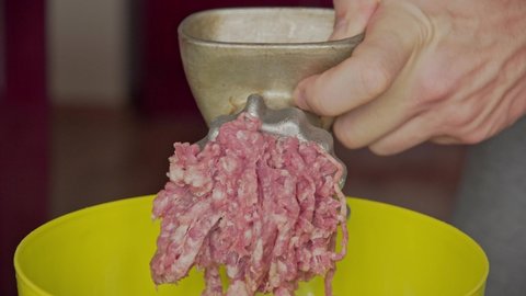 Cooking Minced Meat at Home. Hands In A Light Kitchen Make Minced Meat On A Handmade Old Meat Grinder. Meat Cooking Concept