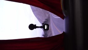 vertical video of a camera anchored to the windshield of a travel bus in the front window to record the entire journey