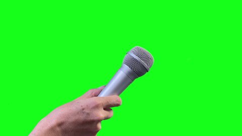 Mic Isolated on Green Screen,  Microphone Cut Out on Green Chroma Background. Close Up. You can replace green screen with the footage or picture you want with “Keying” effect in After Effects. 4K.