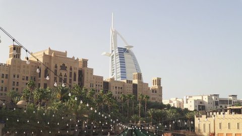DUBAI, UNITED ARAB EMIRATES - CIRCA 2021: Burj Al Arab hotel seen from Souk Madinat Jumeirah shopping complex.