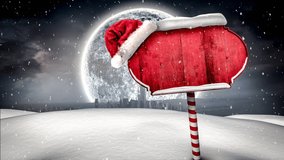 Animation of falling snowflakes over blank sign with christmas santa hat and full moon. christmas, tradition and celebration concept digitally generated video.