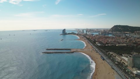 Aerial view of the beaches of Barcelona, port and castle on the Montjuic mountain. famous tourist beaches of Barcelona from the drone