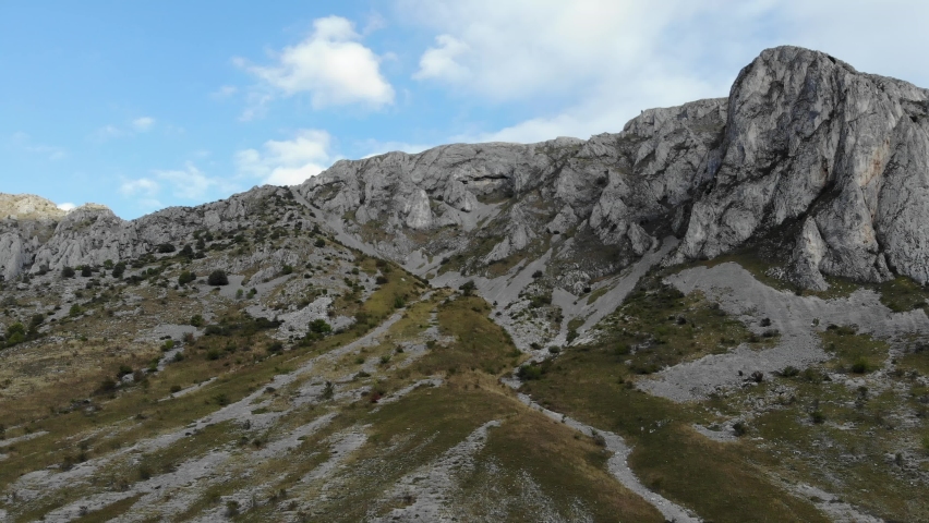 Rocky hills and blue sky autumn aerial footage
