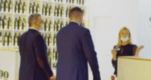 silhouettes of unrecognizable people in a business meeting. blurred defocused video. business background.
