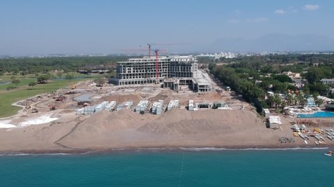 Deluxe resort sea beach hotel building and construction. Drone aerial view.