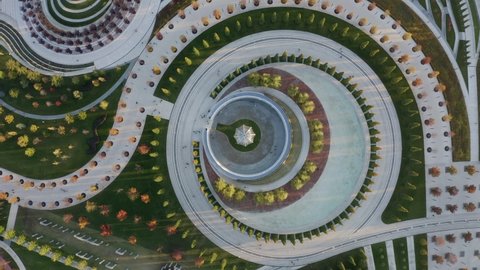 Krasnodar, Russia - October 27 2021: Aerial view. Galitsky Park in autumn. Patterns, walking areas, urban sculptures, gardens exotic trees, rapids, fountains and labyrinths from drone. Futuristic city