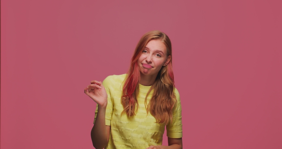 So-so gesture. Puzzled doubtful skeptic young girl waving palm hand, frowning, grimacing expressing doubting, hesitating