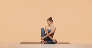 Happy yogi girl practice yoga in studio. Pilates sport club advertising. Woman wellness and healthy lifestyle concept