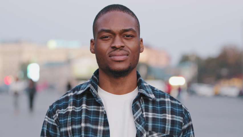 Male portrait in city african american guy handsome young adult man looking at camera disappointed face feeling sad displeasure upset loses losing doing lost gesture hands talking problem concept Royalty-Free Stock Footage #1082301334