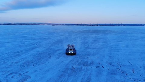 Hovercraft moves along the frozen Ob River. Drone footage before hovercraft. Salekhard. Yamal. Russia.