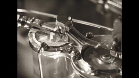 1930s: Animated fuel flows into a glass globe. A drop falls in and starts to swim. The drop timidly tries the temperature of the fuel and finds it cold.