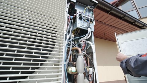 HVAC technician installs heating, ventilation and air conditioning systems. Heat pump