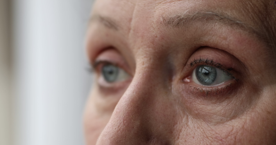 Close up side view of old age female eyes looking staring forward caught with serious thoughts having good eyesight seeing things at distance after laser vision correction surgery. Focus on one eye | Shutterstock HD Video #1082309503