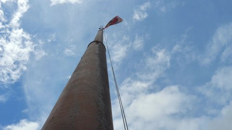 Czech flag on high flagpole.