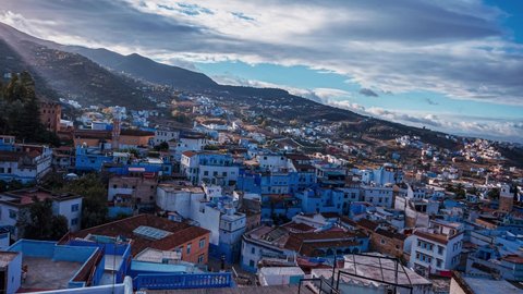 Aerial timelapse view of the beautiful Chefchaouene town in Morocco. Colorful blue houses by the mountains. Magical Morocco traditional village.