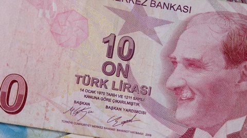 Red 10 turkish lira paper money banknote with monogram revolutionary statesman, founding father and first president Mustafa Kemal Ataturk. Monetary concept, official currency, TRY paper bill