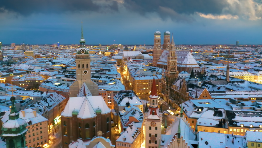Marienplatz Munich aerial skyline aerial view at winter with snow old town, fly over town hall frauenkirche church, Munich in a bird's-eye view. The Marienplatz square.  Royalty-Free Stock Footage #1082330695