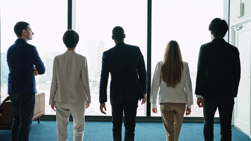 Group of multi racial people standing in front of windows. Global business. Teamwork of business. Diversity. | Shutterstock HD Video #1082335966