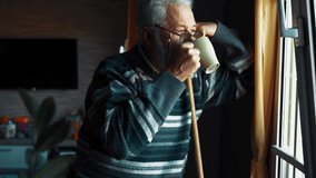 Senior man looking through window - Powered by Shutterstock - Get 15% off with code: PIKWIZARD15