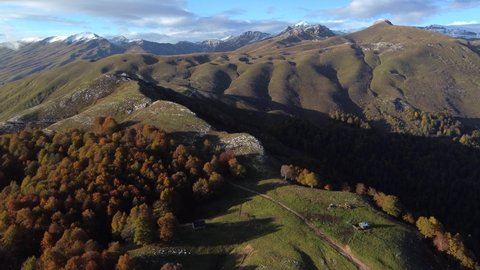 Aerial video from a drone overlooking green meadows in the Caucasian mountains of Abkhazia, on the Arabica plateau. Mountain nature of incredible beauty.