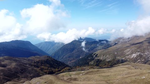 Aerial video from a drone, overlooking the snow-capped peaks in the Caucasian mountains of Abkhazia, on the Arabica plateau. Mountain nature of incredible beauty.