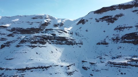 Aerial video from a drone, overlooking the snow-capped peaks in the Caucasian mountains of Abkhazia, on the Arabica plateau. Mountain nature of incredible beauty.
