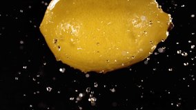 Flying of Lemon in Black Background in Slow Motion - Powered by Shutterstock - Get 15% off with code: PIKWIZARD15