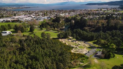 Scenery of Lake Taupo and Taupo town, aerial over mountain bike park. Beautiful day in New Zealand