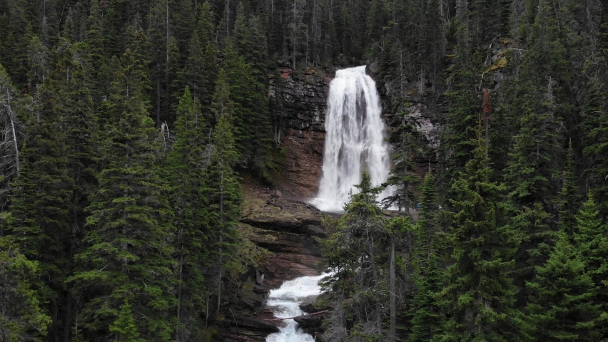 Virginia Falls, Glacier National Park, Montana USA. Cinematic Aerial View