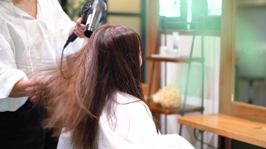 A woman at a hair salon Royalty-Free Stock Footage #1082386210