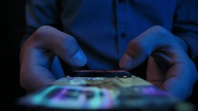 Young Man Look in Smartphone and Browse Social Network Close up. 30s Millennial Online Touch Fingers of Cell Phone Chatting Indoors. Relaxed Adult Man Read App Cellphone at Night. Life in Mobile Phone - Powered by Shutterstock - Get 15% off with code: PIKWIZARD15