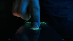 Person Activate Id in Fingerprint Scanning on Tech Device Panel Close-up. Human Turn on Neural Network Visualization Hologram. Concept of Digital Start Identification Sensor Screen in Industry Four 4k - Powered by Shutterstock - Get 15% off with code: PIKWIZARD15