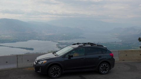 Car at look out overlooking Osoyoos, BC.