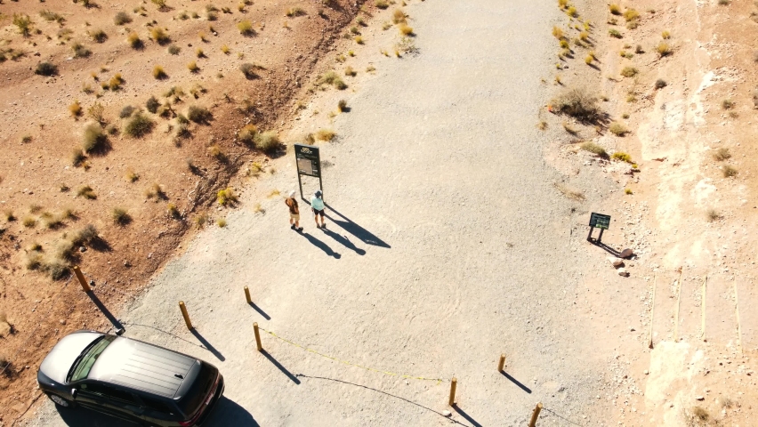 People In Nevada Desert Parking Lot