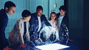 Multi racial group watching hologram of the earth in dark office. Global network. - Powered by Shutterstock - Get 15% off with code: PIKWIZARD15