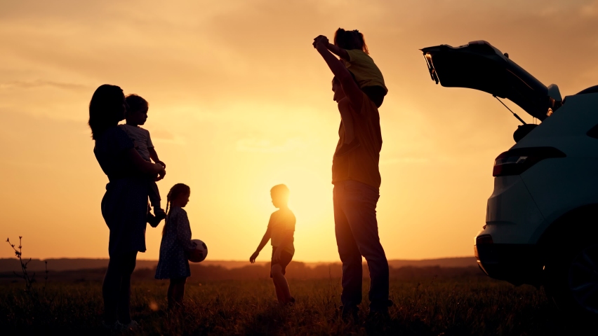 Happy family travel by car.People are having fun on vacation at sunset.Father mother and children picnic in nature.Car travel concept. Children play in park.Happy family concept.Family vacation by car Royalty-Free Stock Footage #1082399197