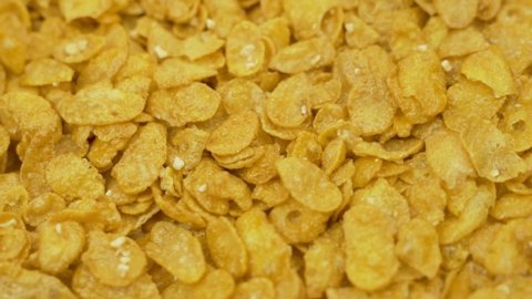 Corn Flakes with Honey, Close-up, Macro. Cornflakes Rotation, Cornflakes Background, Isolated. Healthy Breakfast, Healthy Vegetarian Food.