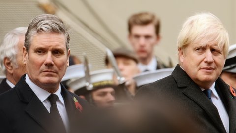 LONDON, NOV 2021 - Keir Starmer, leader of the UK Labour Party and Opposition stands next to Boris Johnson, British Prime Minister during the Sunday Remembrance Service in Westminster, London, UK
