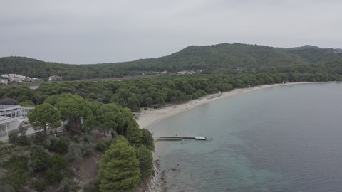 Drone flight towards the seaside in Skiathos in Greece 