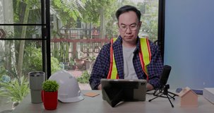 Asian construction engineer have video call meeting with team to design home structure. Architect presenting remote livestream via laptop. webinar with colleagues. Building Materials Business Online