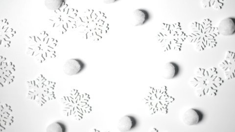 Christmas toy white snowflakes rotate on white background with place for text. New Year composition video greeting card 4k footage